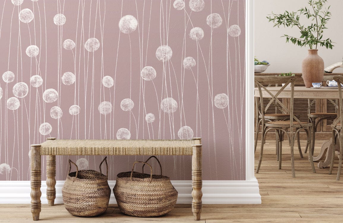 Soft pink wildflower mural wallpaper, rustic bench, wicker baskets, wooden dining chairs, hardwood flooring.