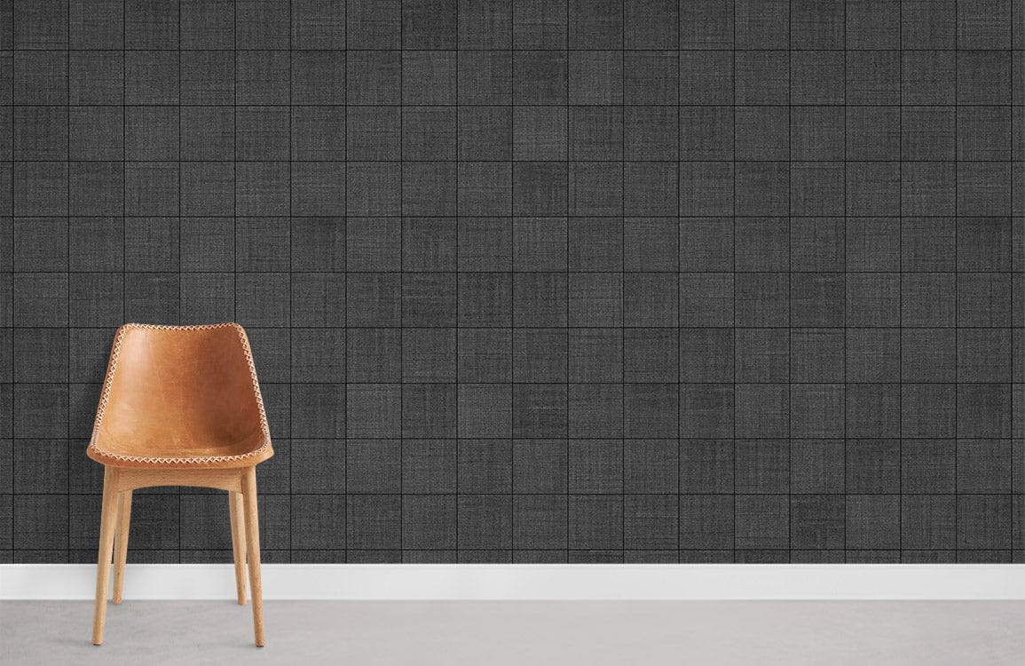 Elegant charcoal grid wallpaper, modern decor; brown chair, grey flooring, contemporary living room ambiance.