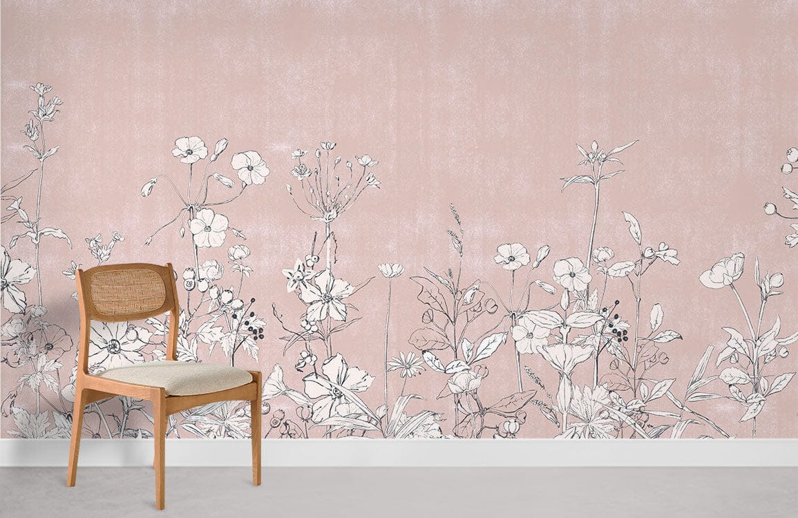 Blush pink floral mural wallpaper with botanical design, wooden chair, grey flooring in minimalist room.